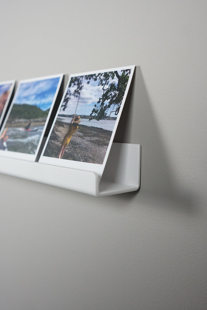 polaroid picture shelving white